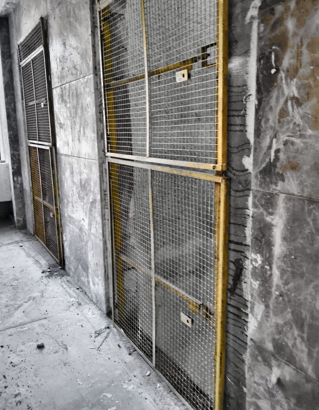 Barricades fitted at two adjacent elevator landings